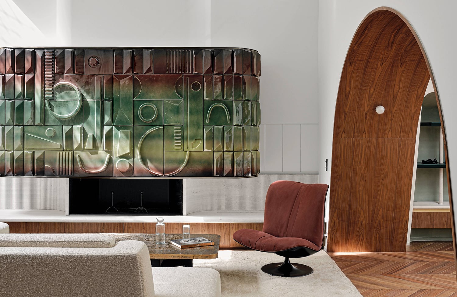 A living room with a large painting on the wall in a residential interior design