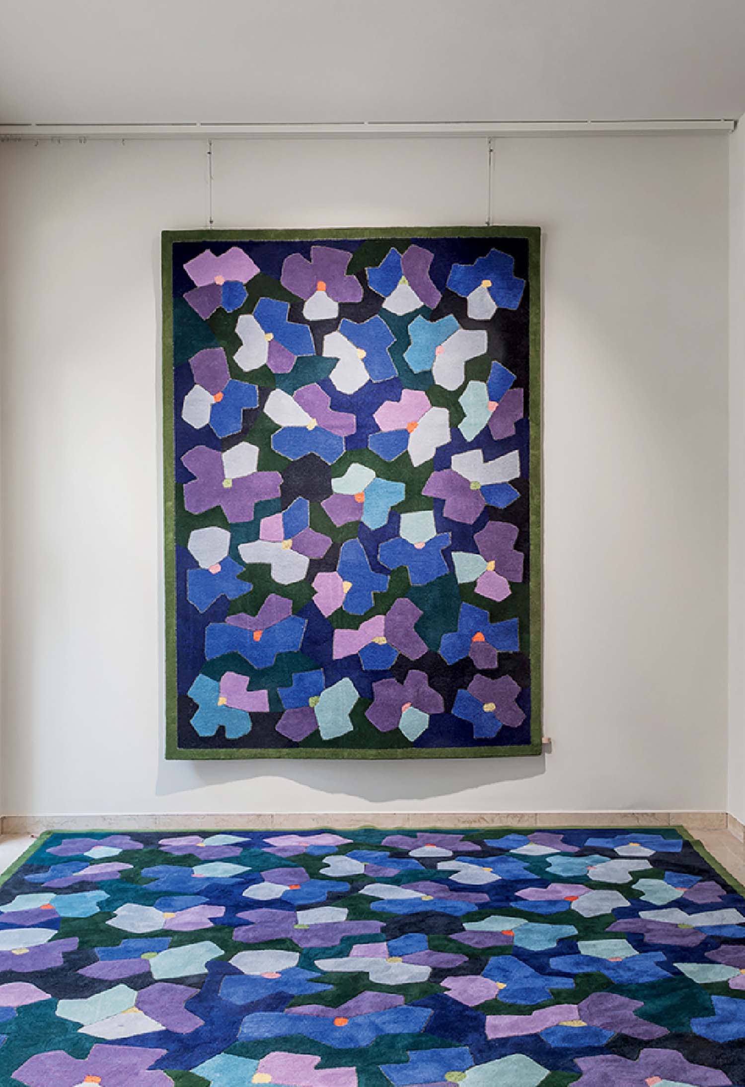 A large rug with a colorful pattern on it.