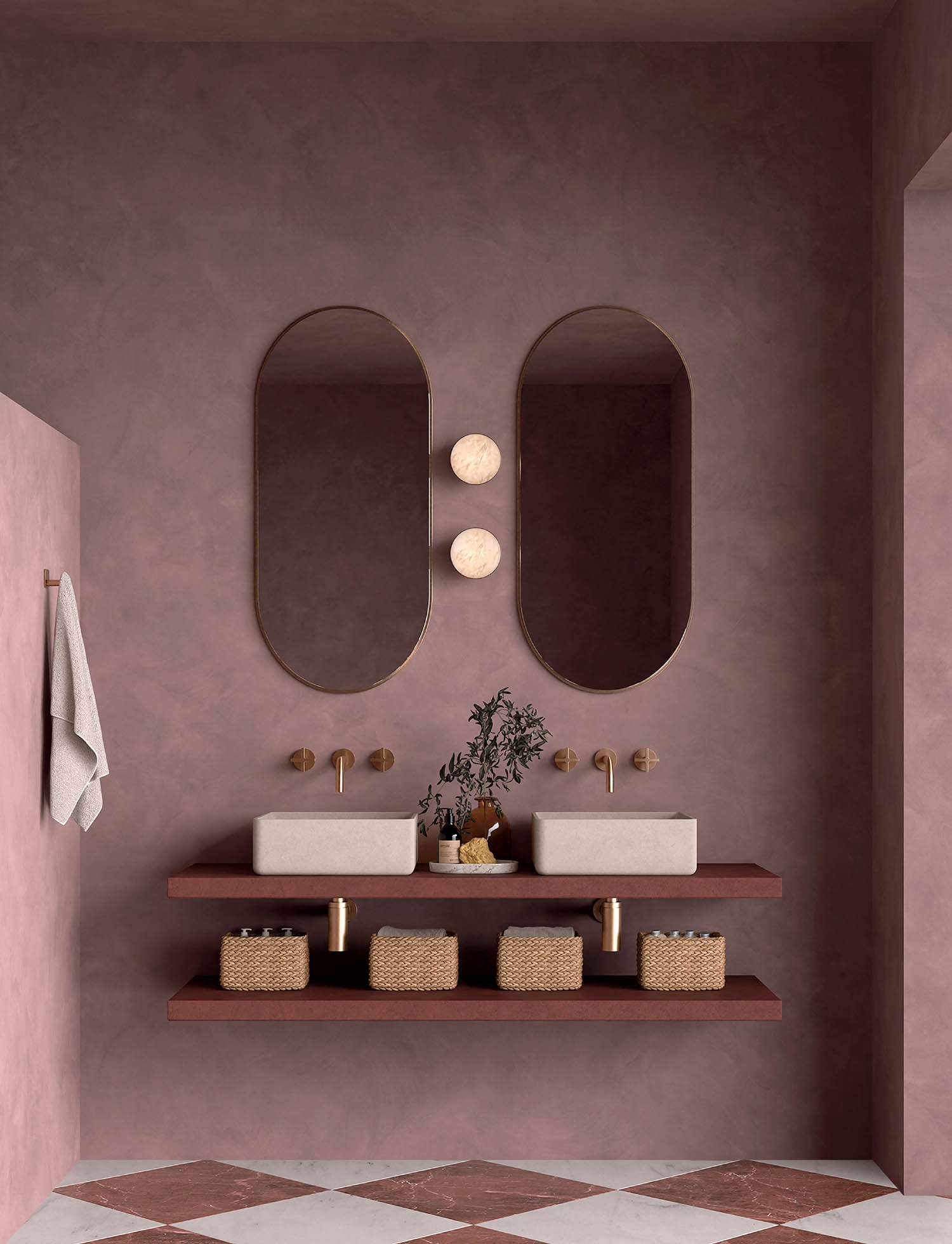 A bathroom with a pink wall and two sinks.