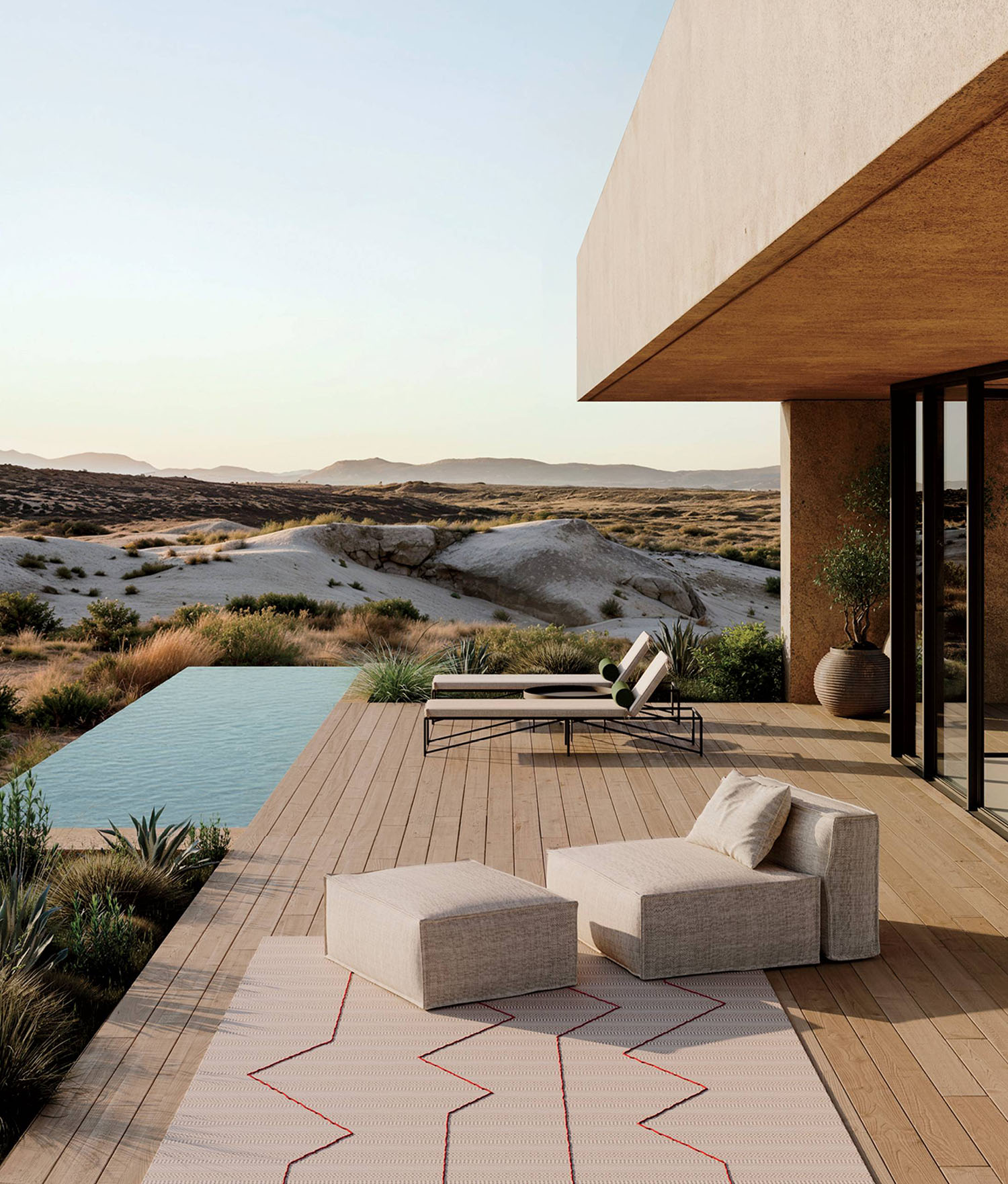 A patio with a couch and a chair.