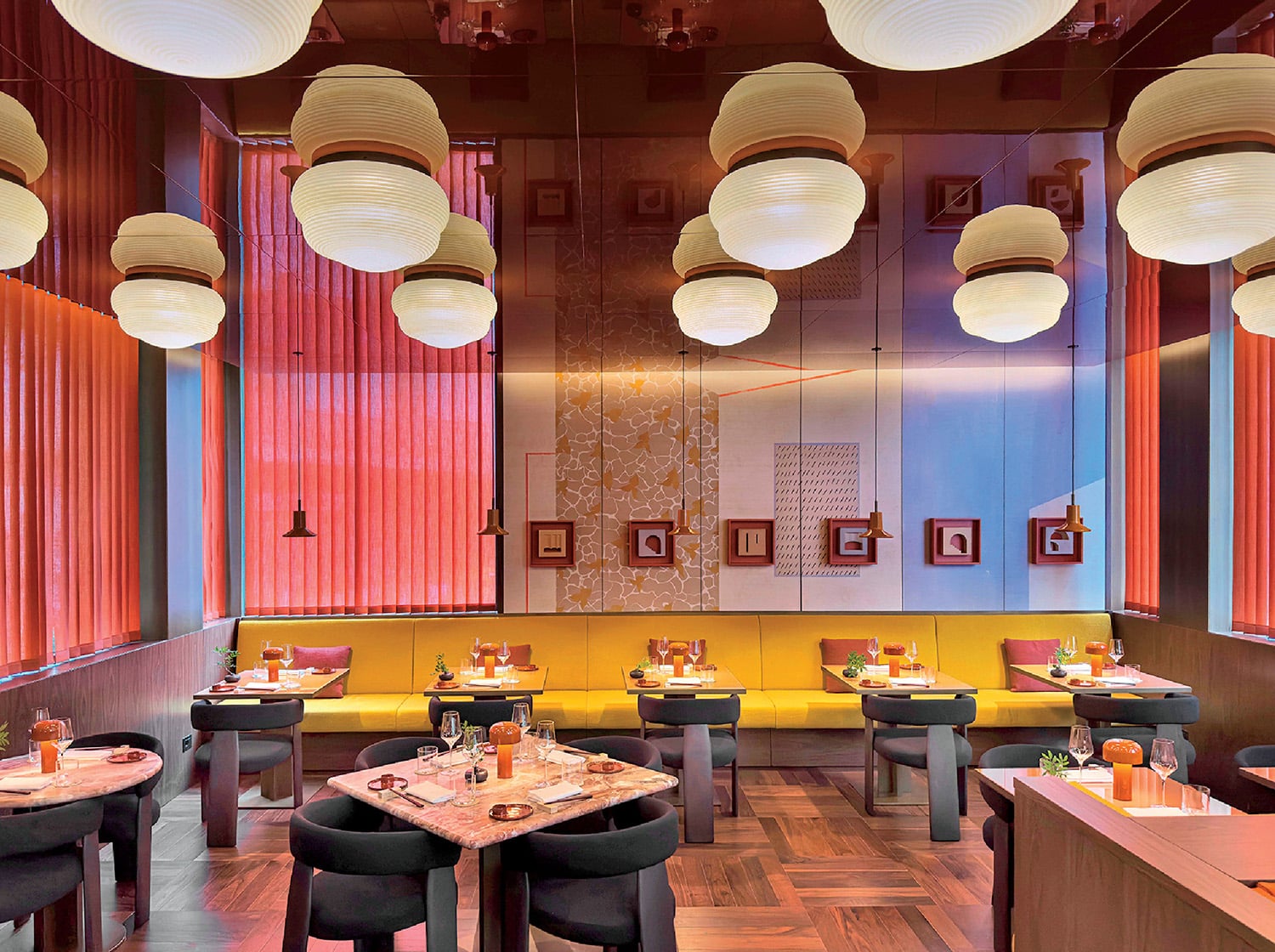 A restaurant with a lot of tables and chairs