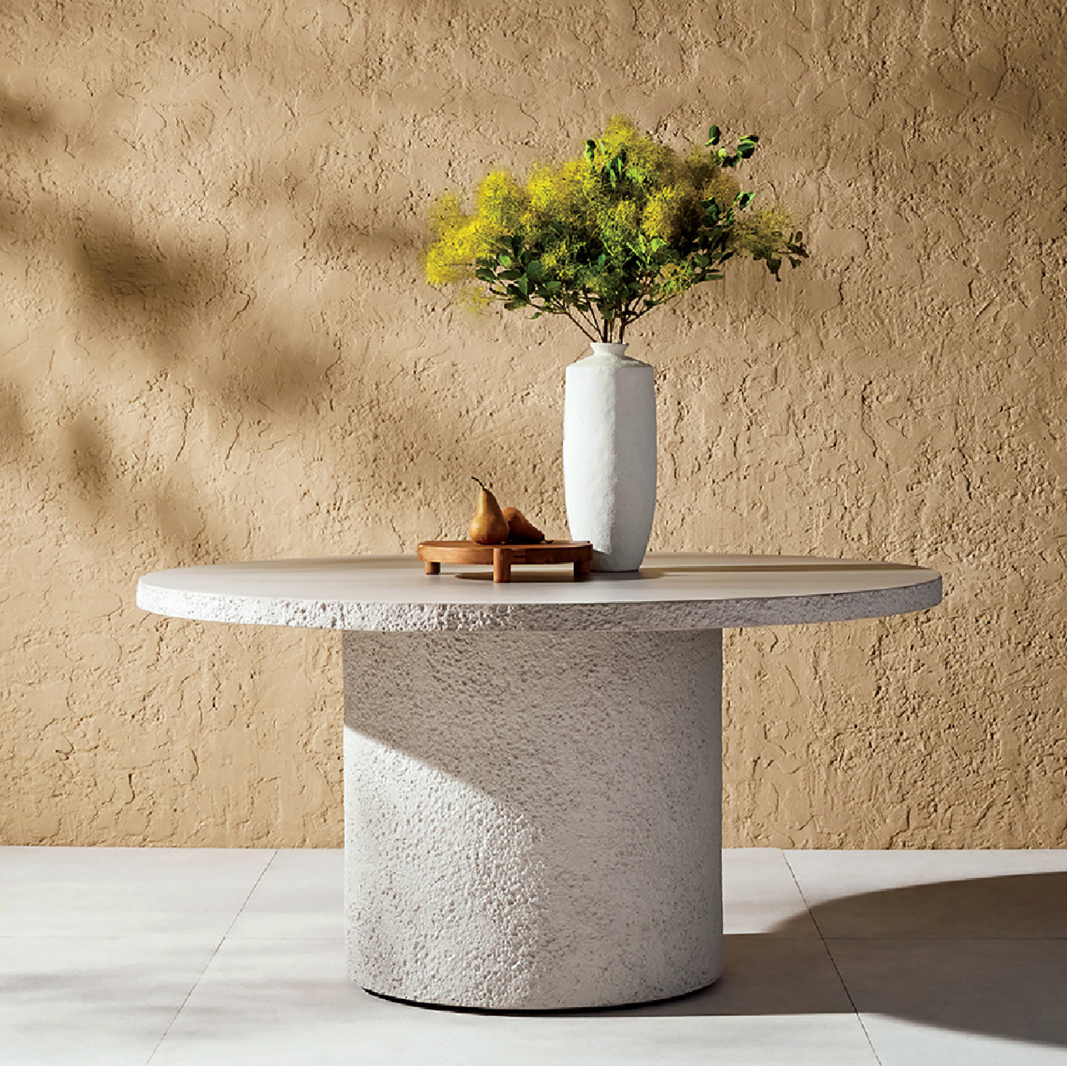 A vase with a flower on a table