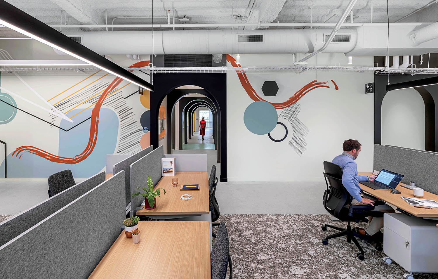A man sitting at a desk in an office.
