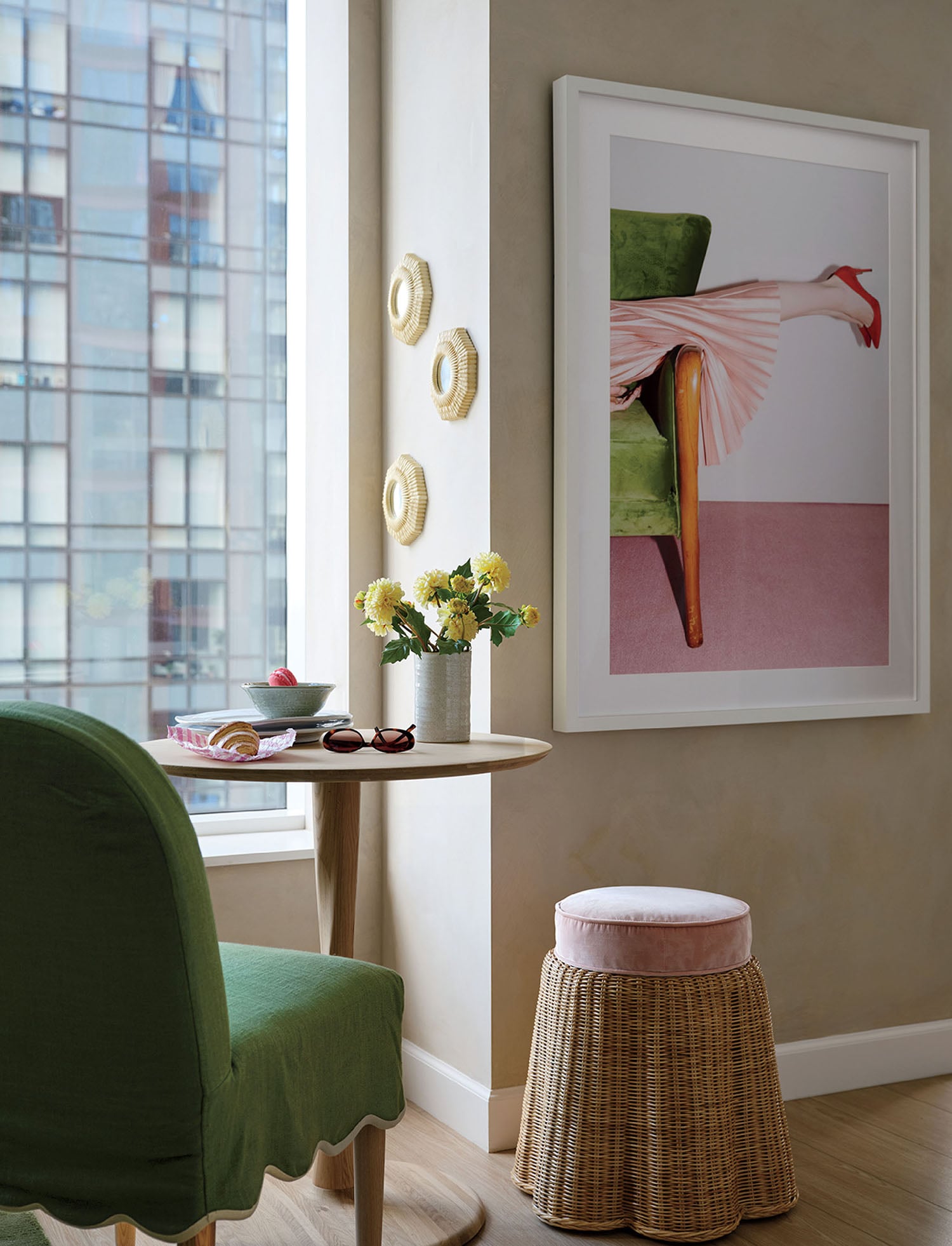 A green chair and a small table in a room.