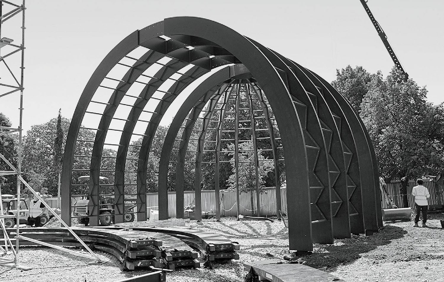 A black and white photo of a building under construction.