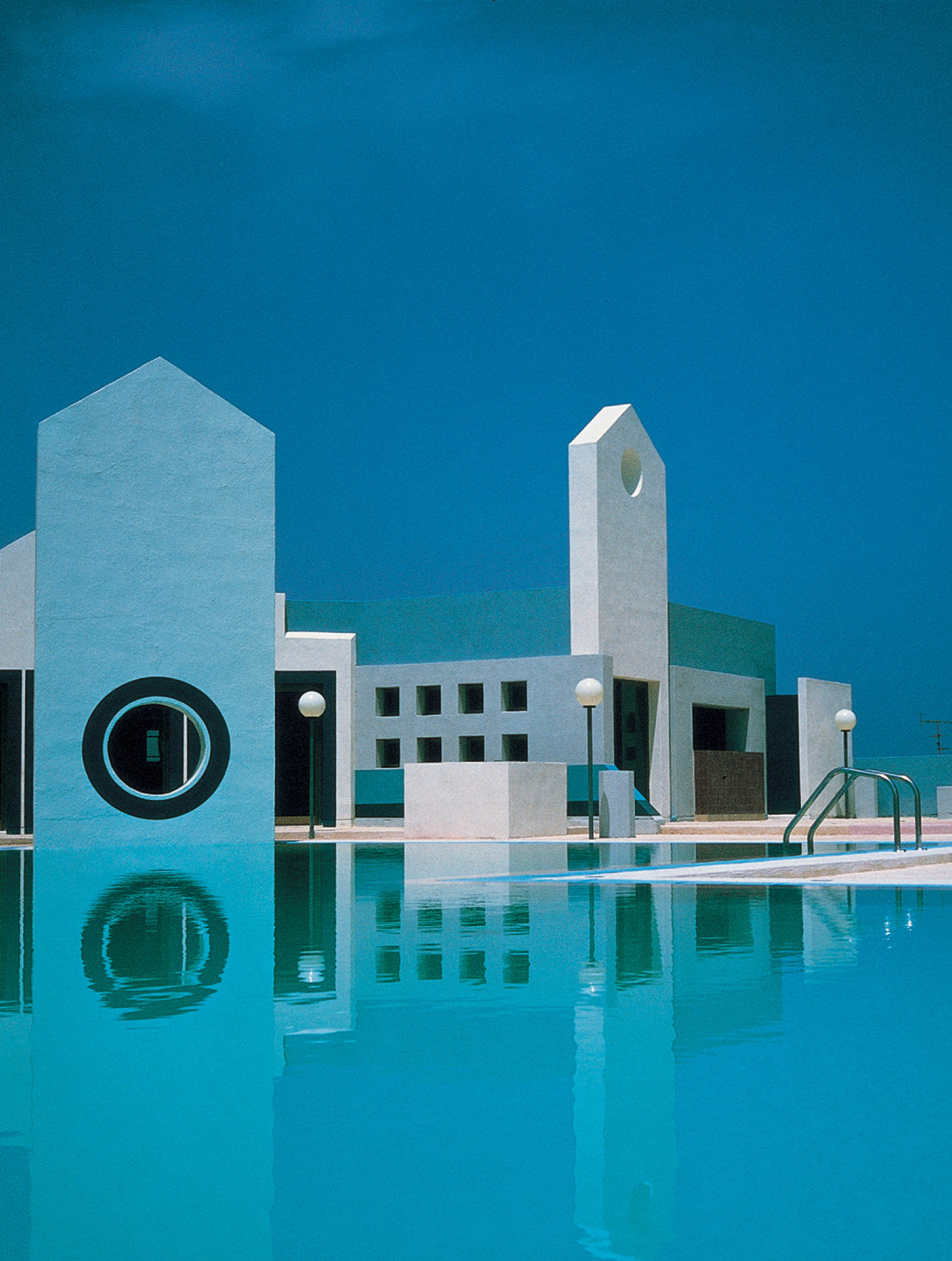 a pool with a clock on the side of it