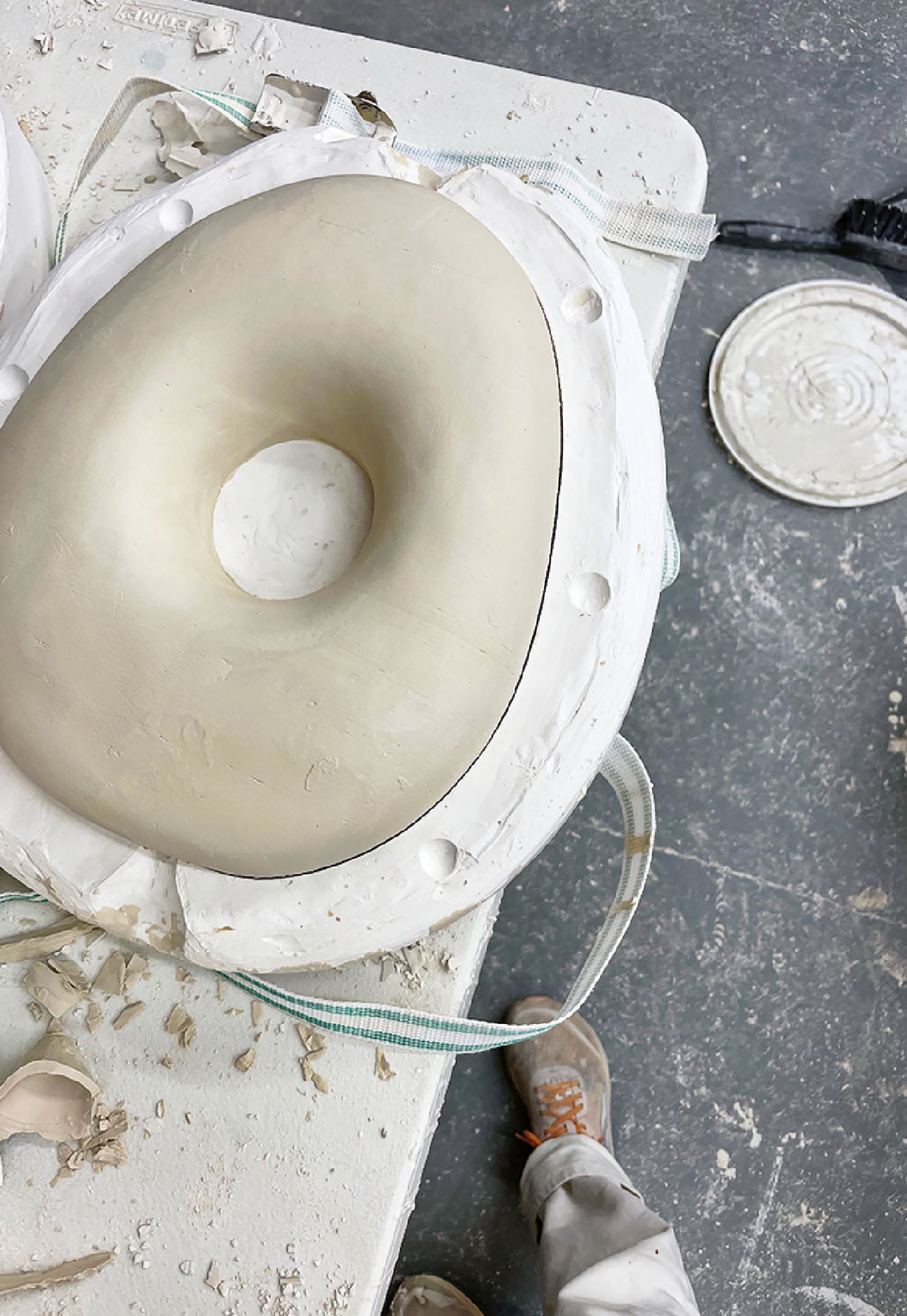 A white dough with a hole in the middle.