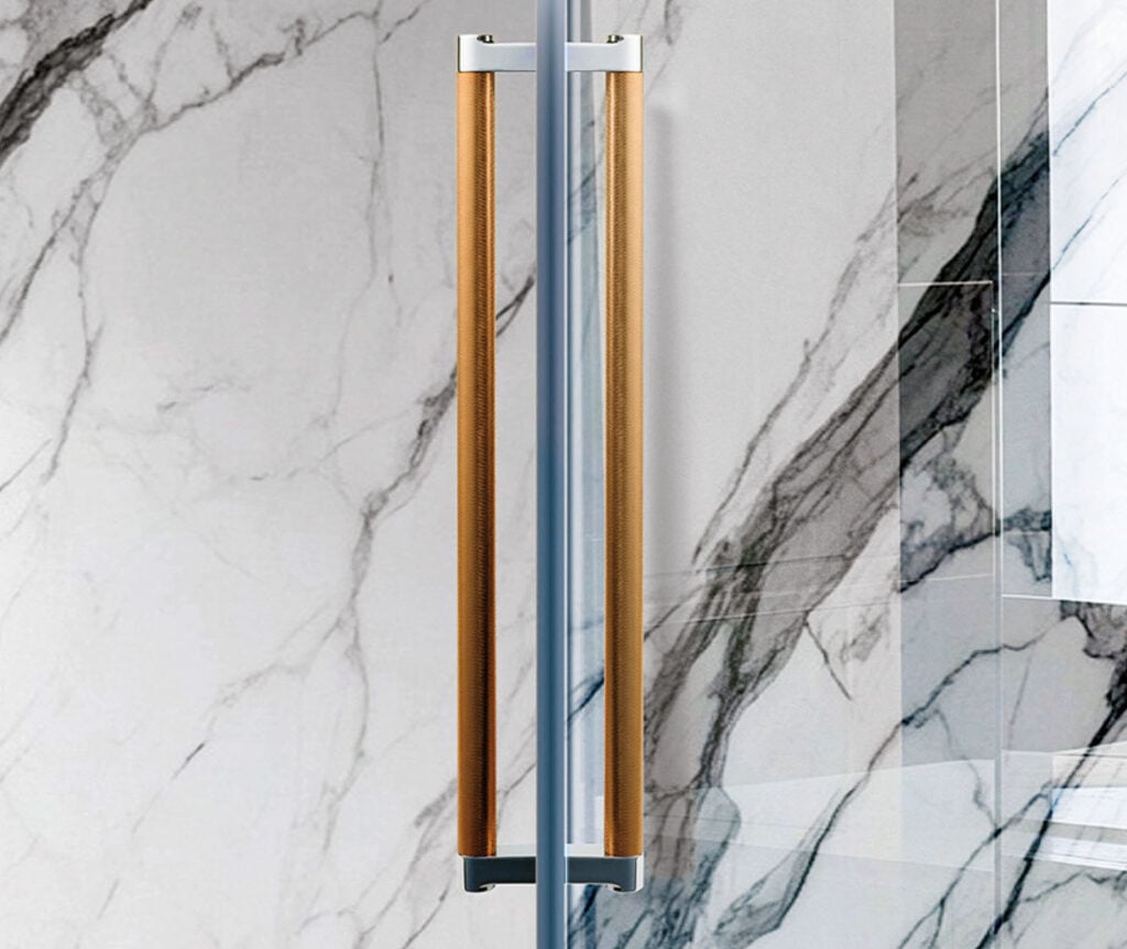 A marble bathroom with a marble shower wall.