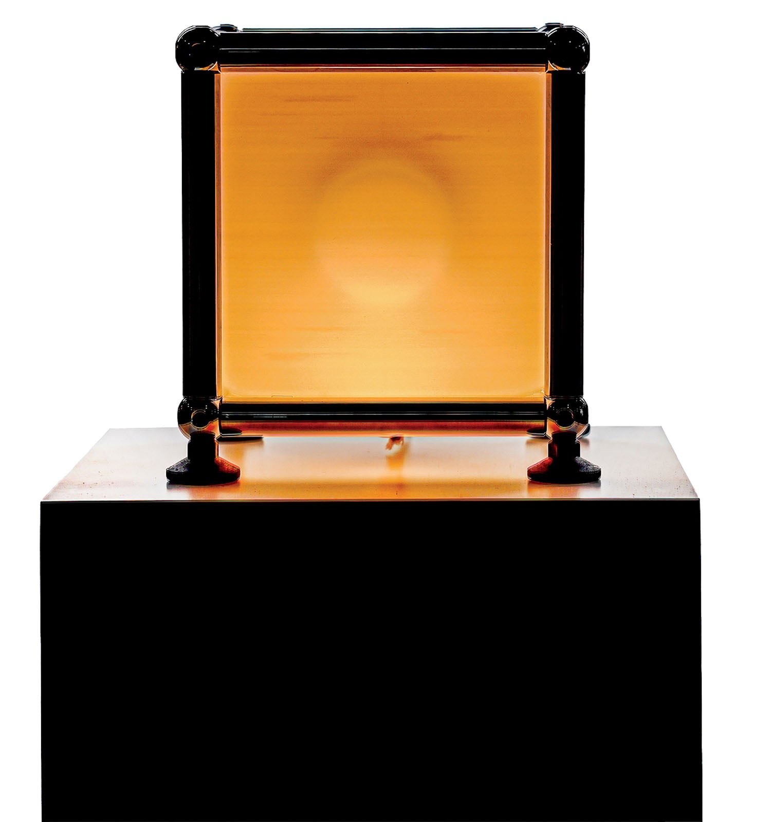 A gold plated trophy on a black pedestal.