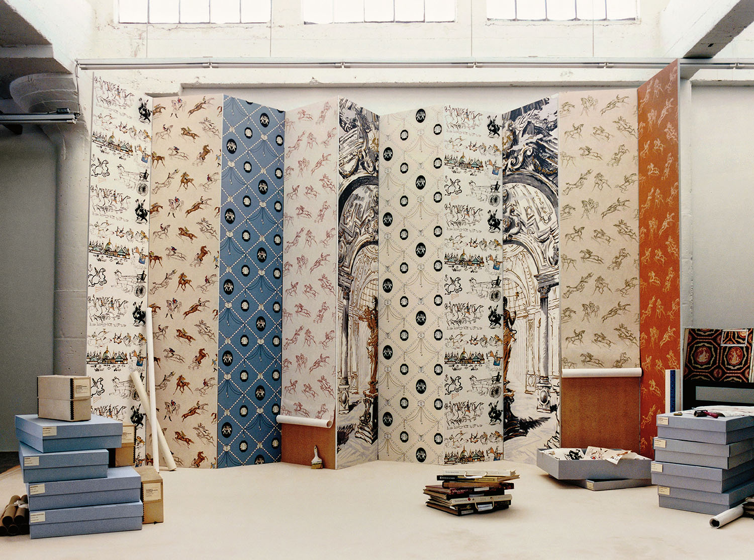 A room with a large wall covered in wallpaper.