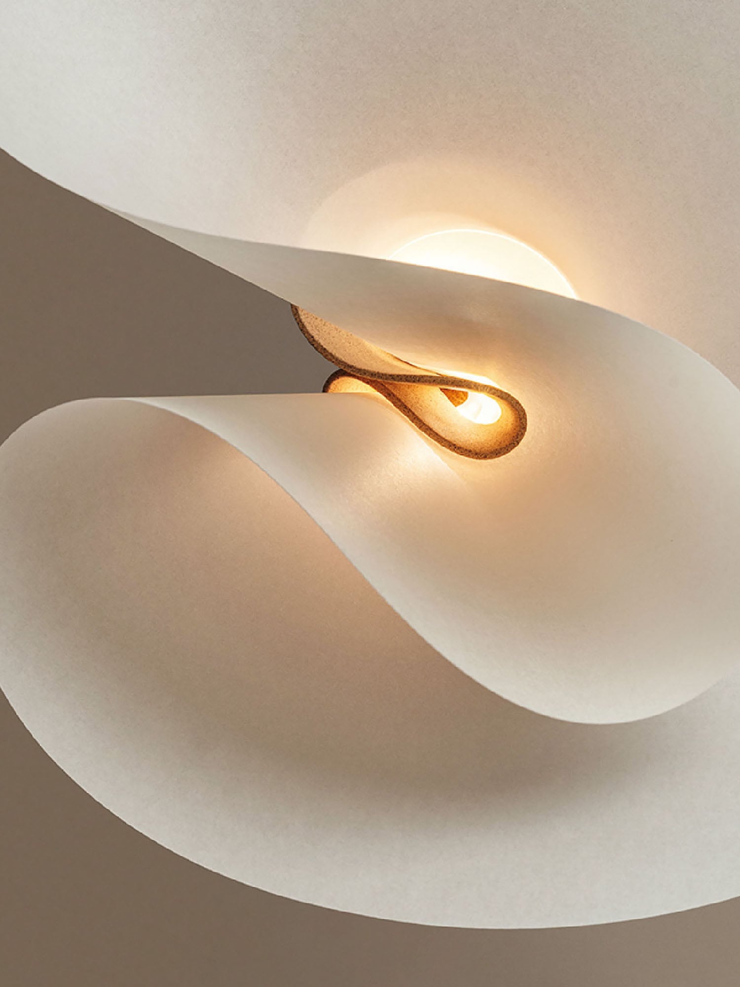 A white ceiling light with a gold ring.