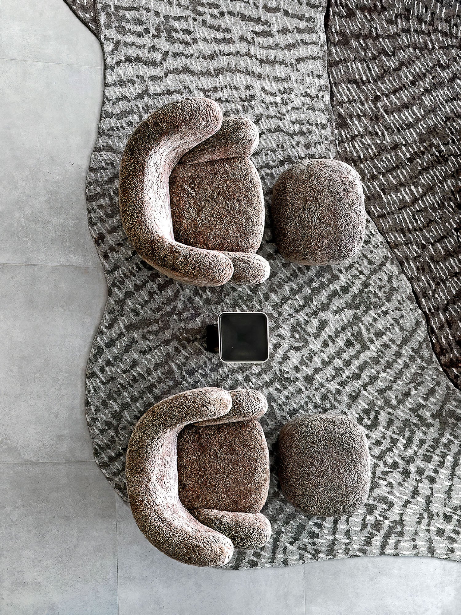 A couch with a phone on it.