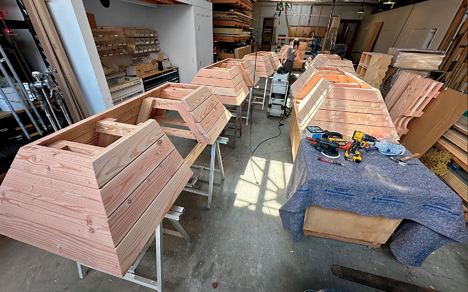 A room with many pieces of wood on the floor.
