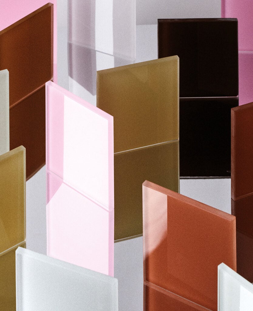 A pile of different colored boxes on a white surface.