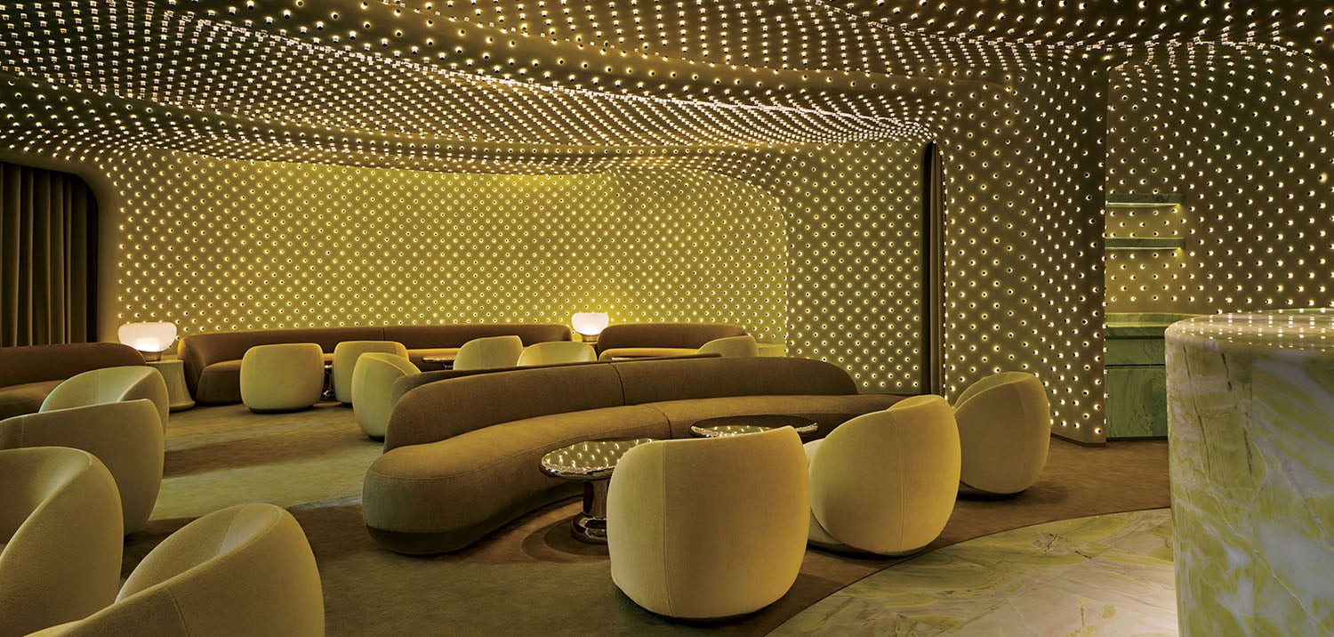 A room with a lot of chairs and a table.