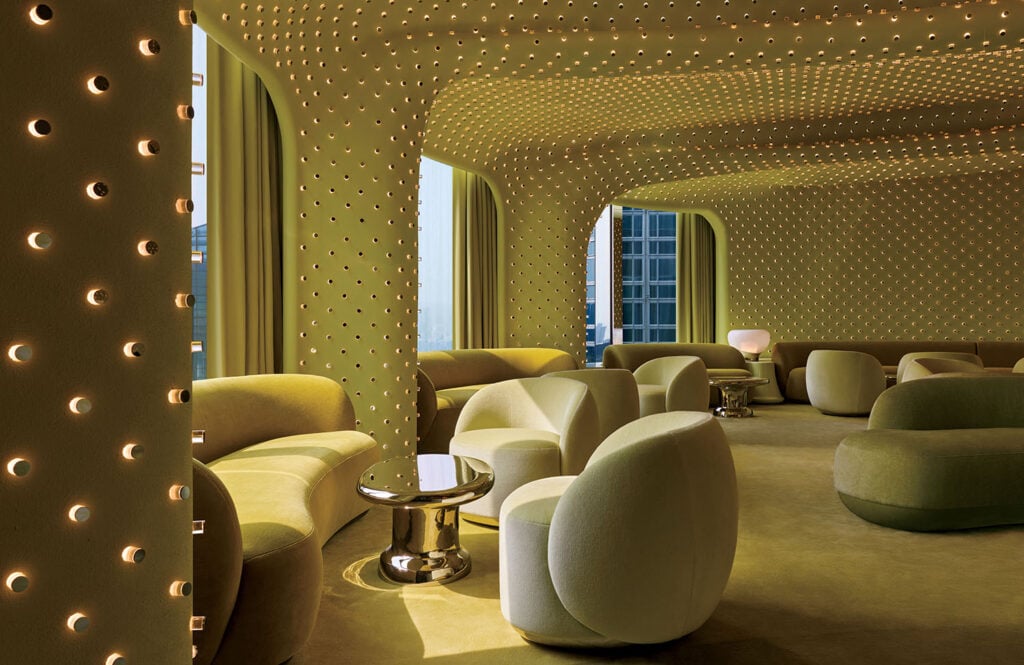 A room with a lot of chairs and a table.