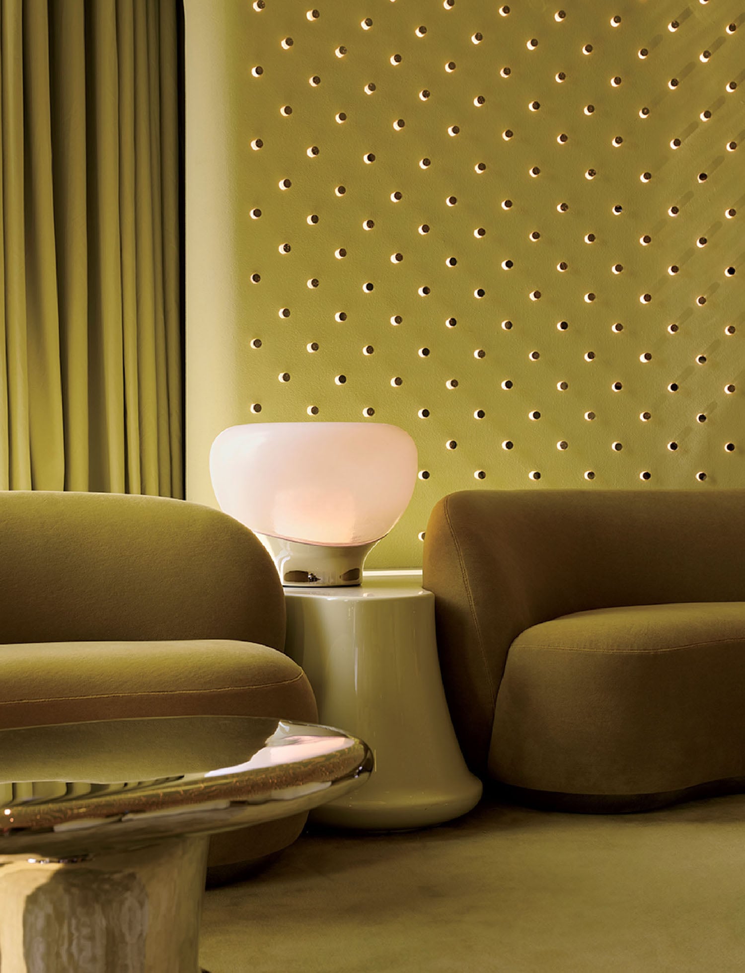 "A living room with a couch, chair, and table".