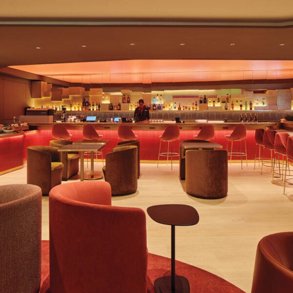 curved red seats in airport lounge