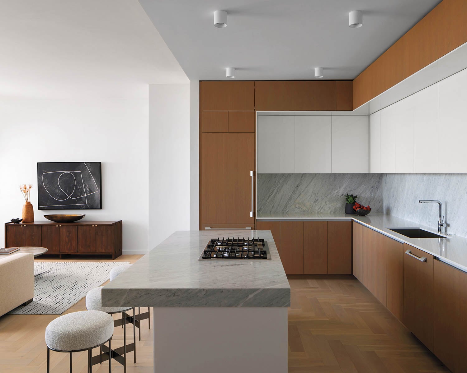 a modern kitchen with brown cabinets