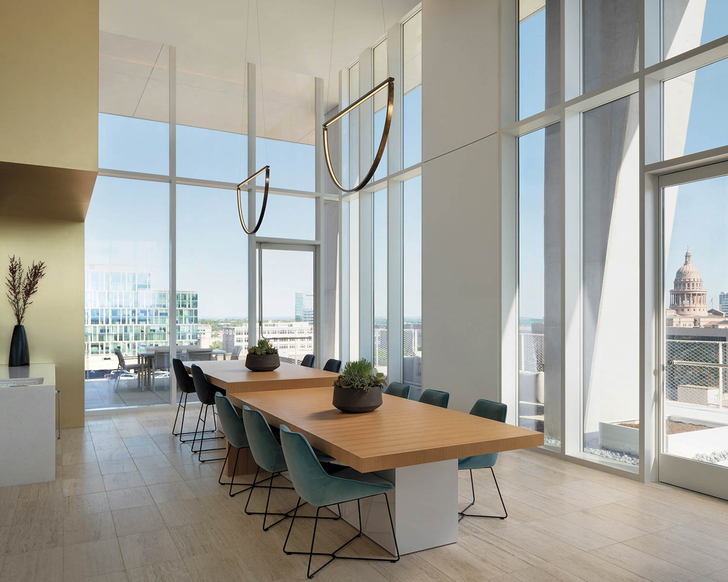 wood table surrounded by glass walls
