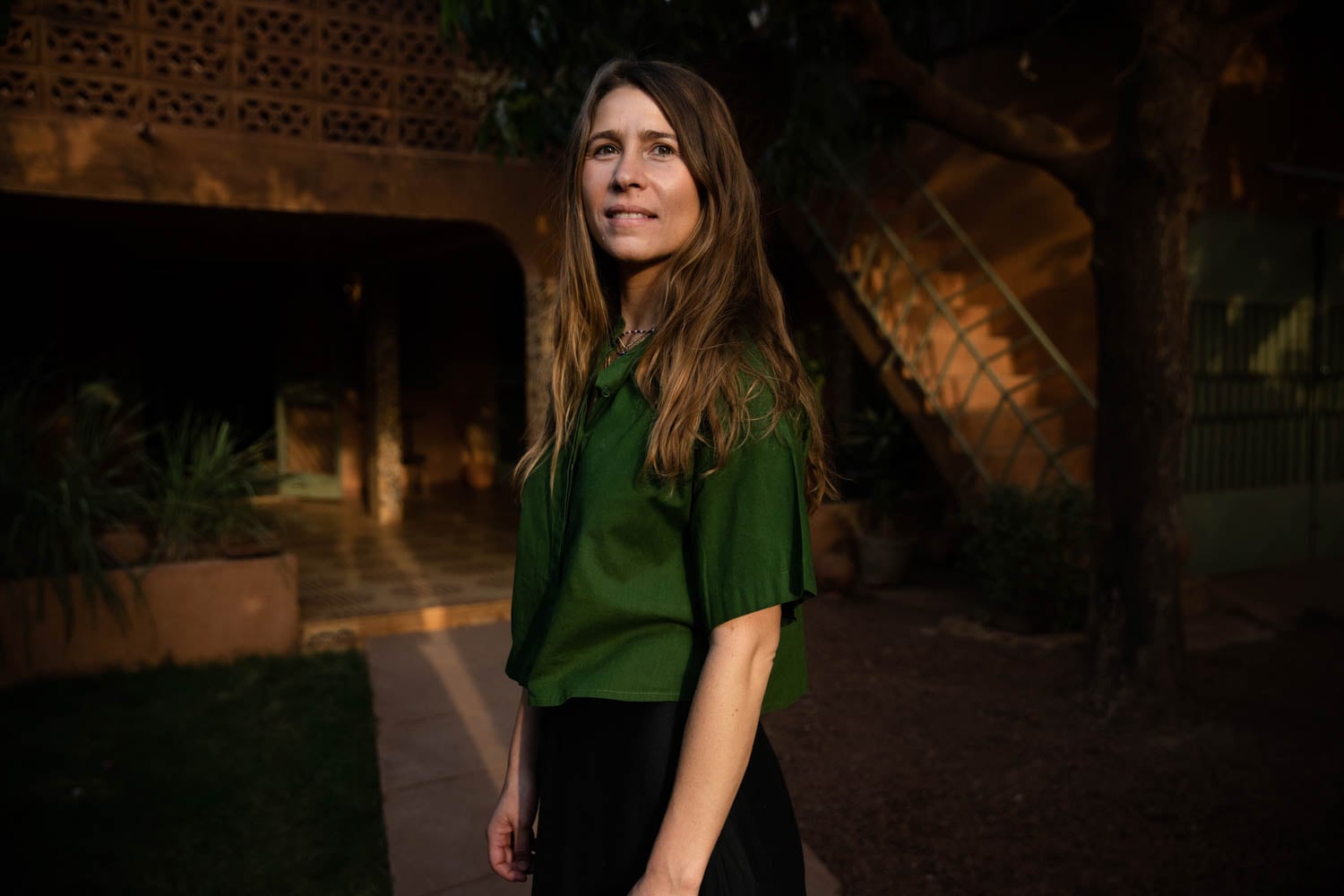 Ambre Jarno, founder of Maison Intègre wearing a green short sleeve shirt 