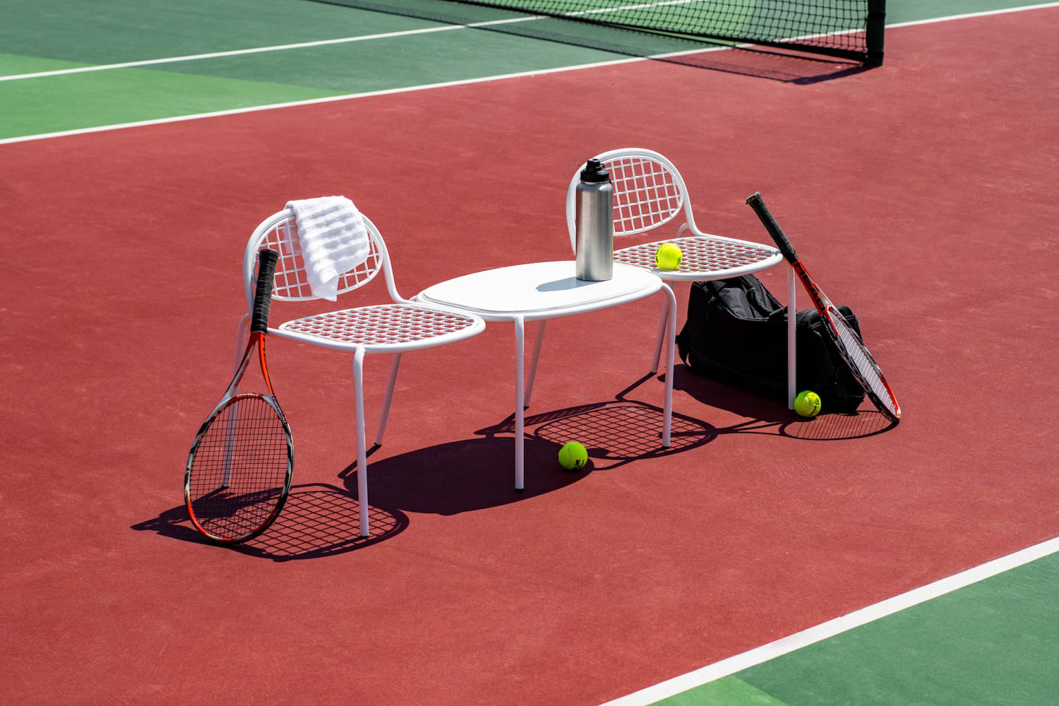 white furniture on a tennis field