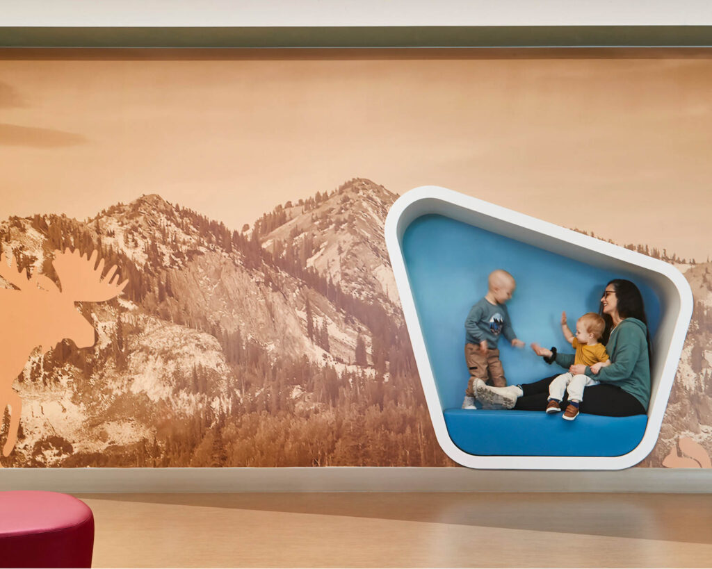 family inside a cube in museum