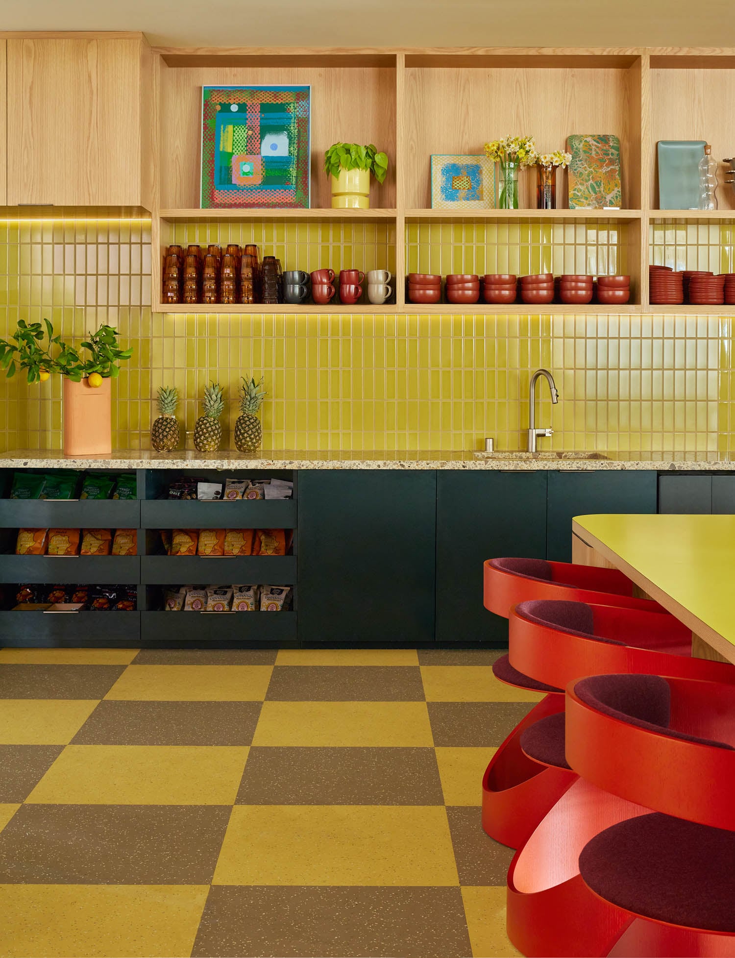 pantry with bright yellow backsplash, checkered tile and shelves