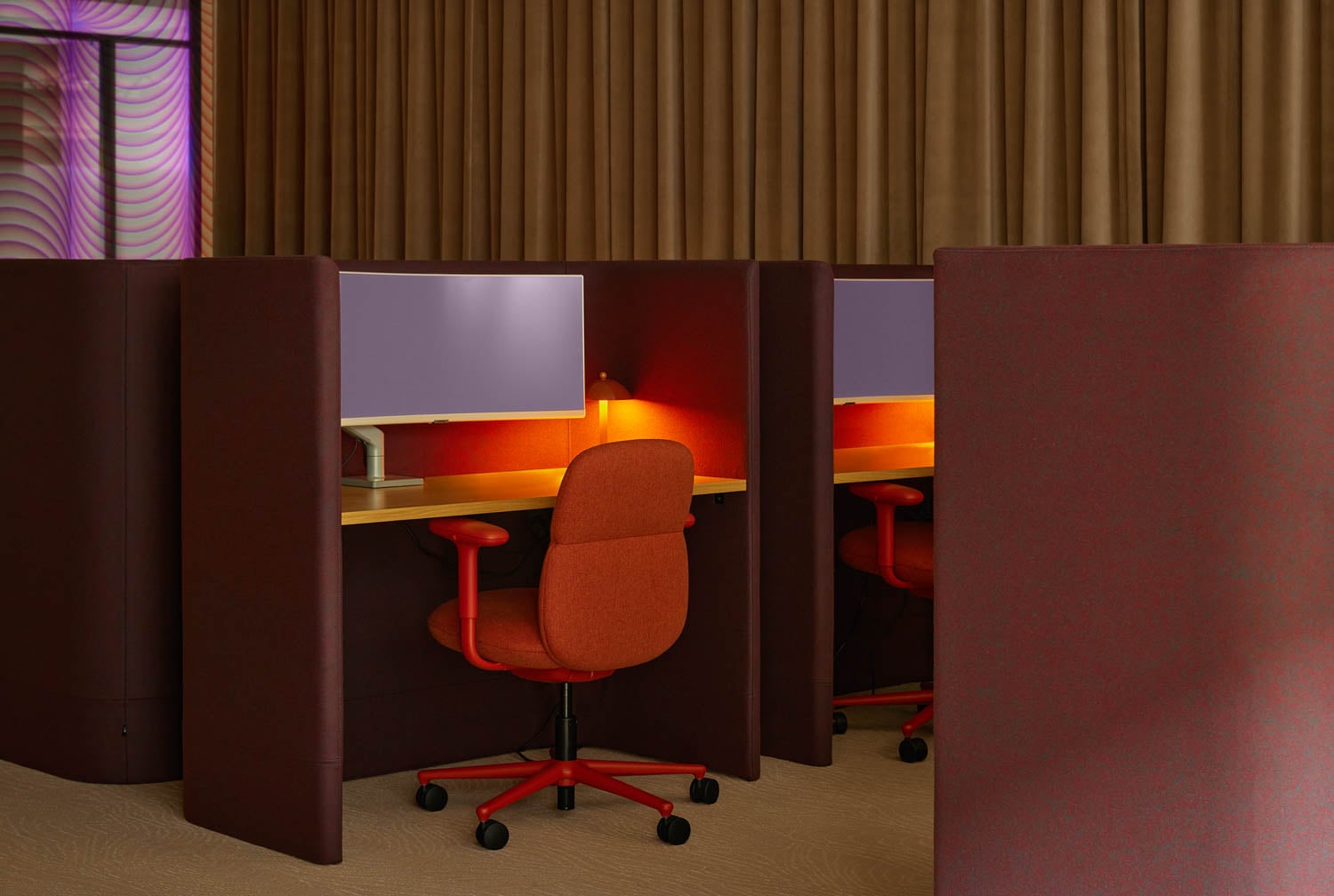 cubicle spaces with dark red walls