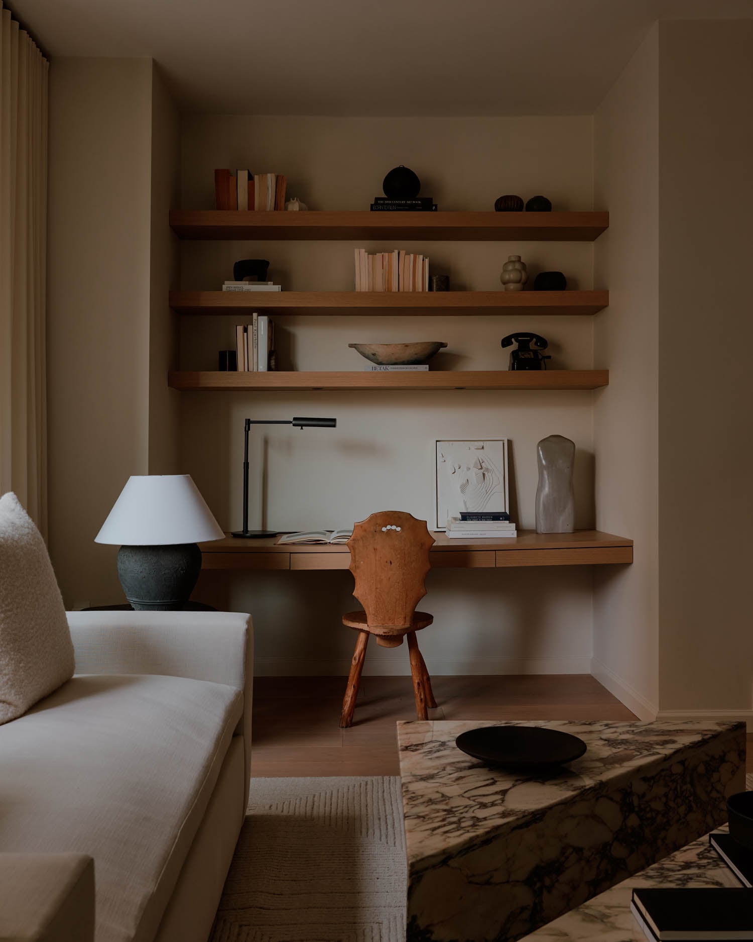 study with shelves and ceramic sculptures