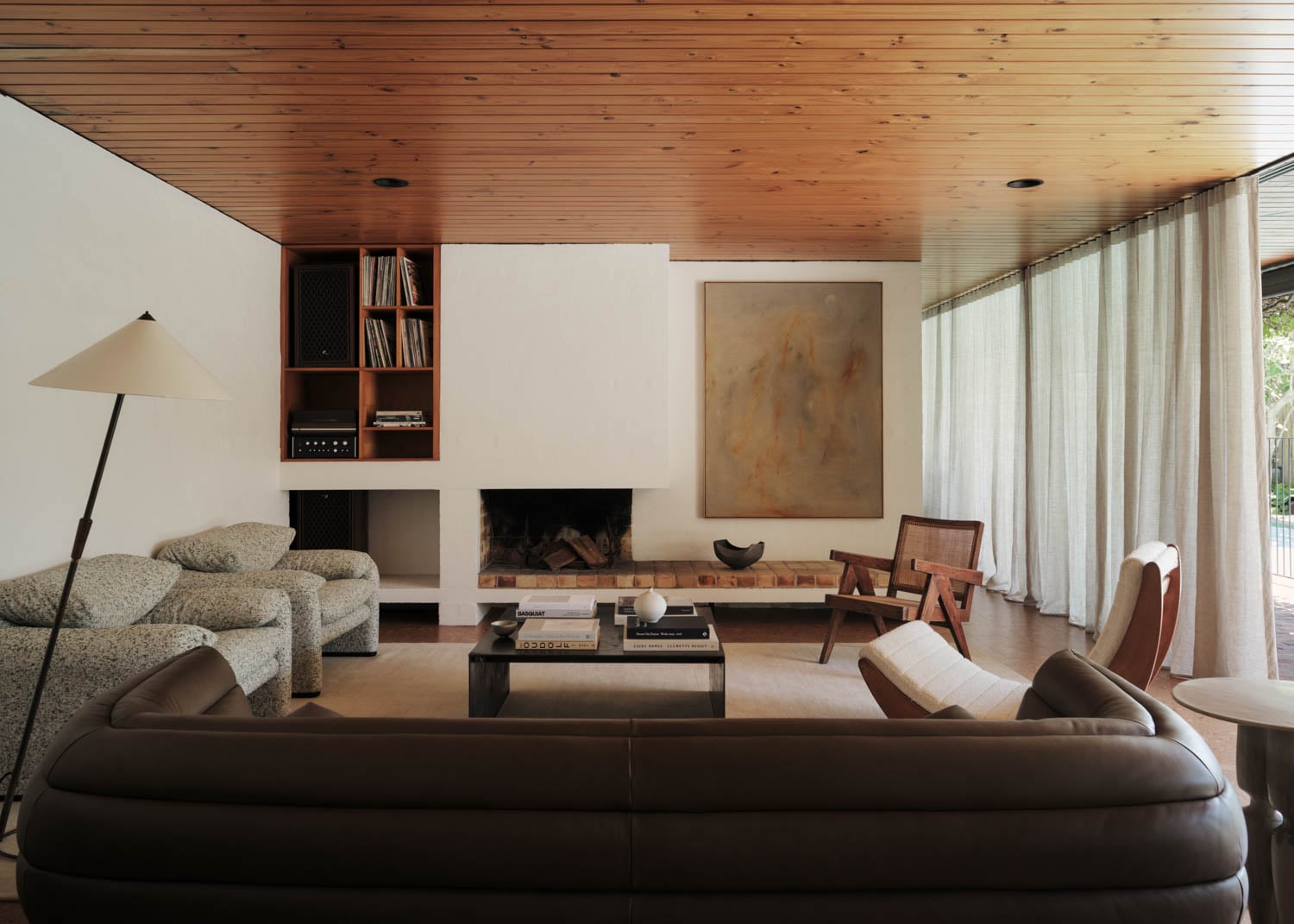 living room with dark brown couch and lots of seating