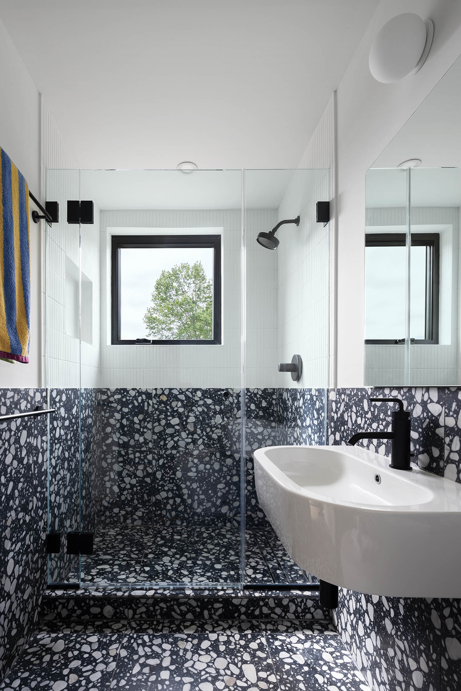 bathroom with dark blue tile