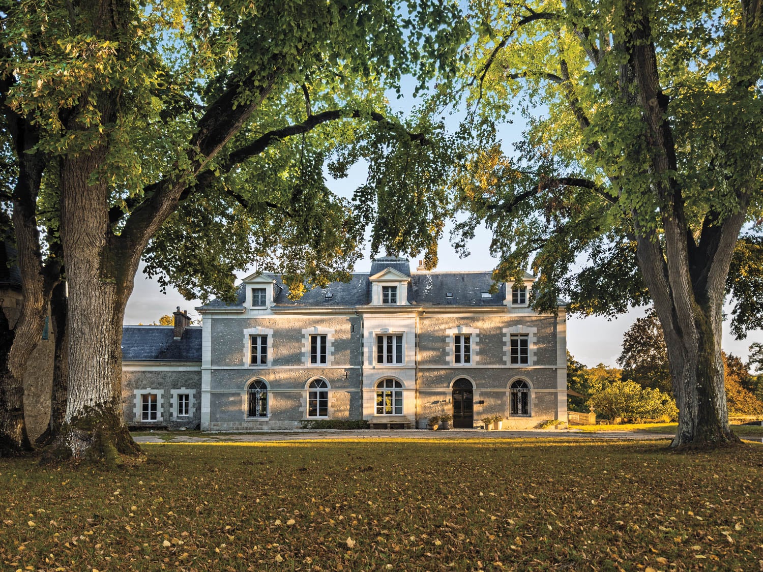 exterior facade of chateau with greenery