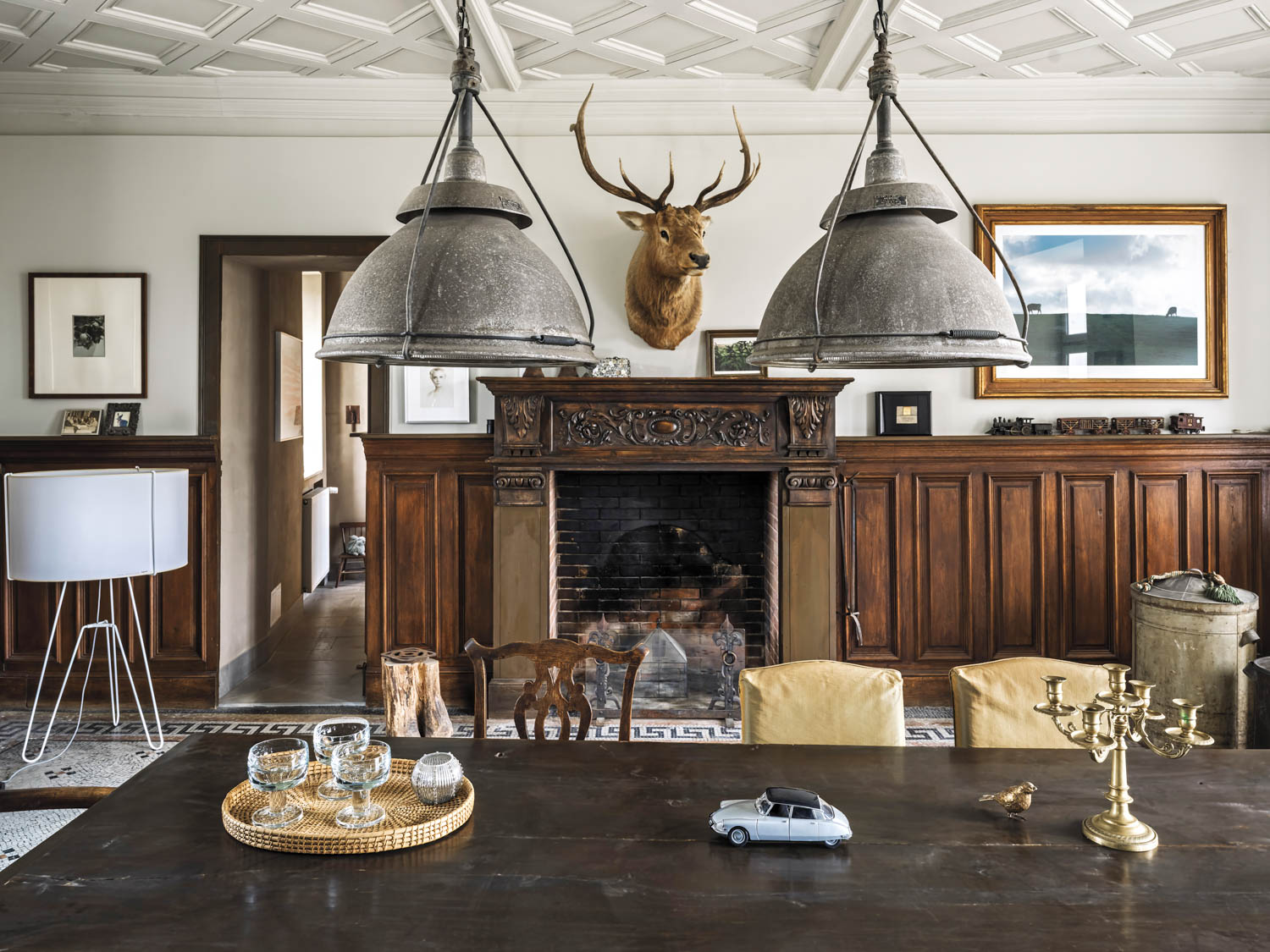 dining room with elk mounted over fireplace