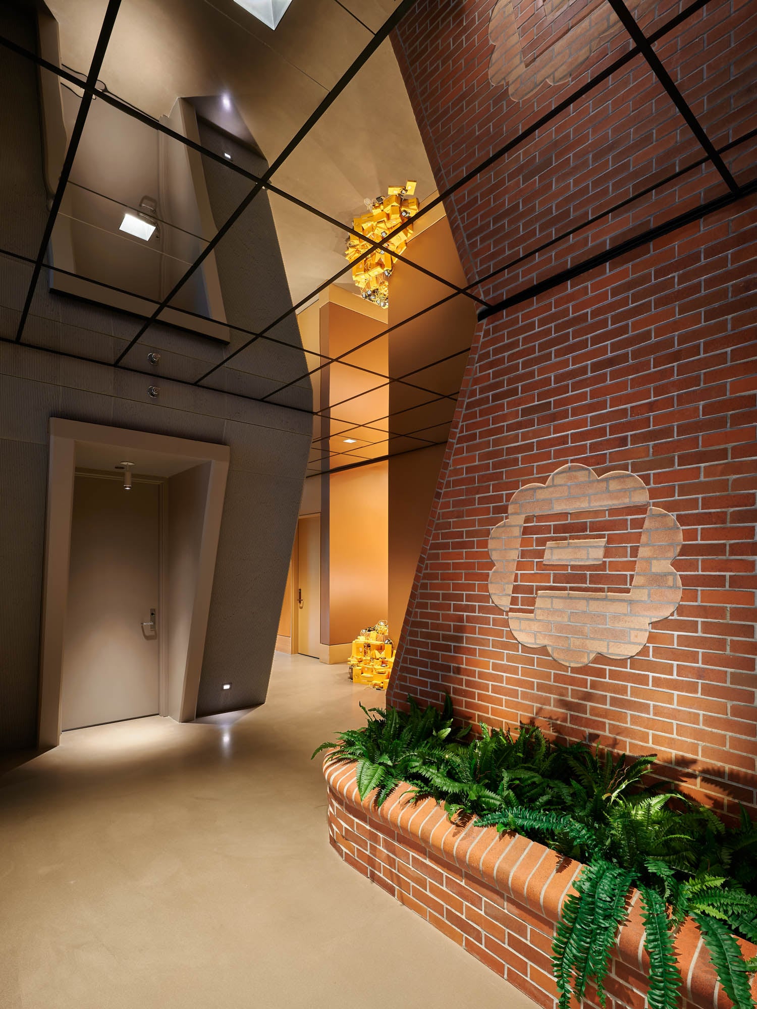 corner of room with a concrete bunker and mirrored ceilings