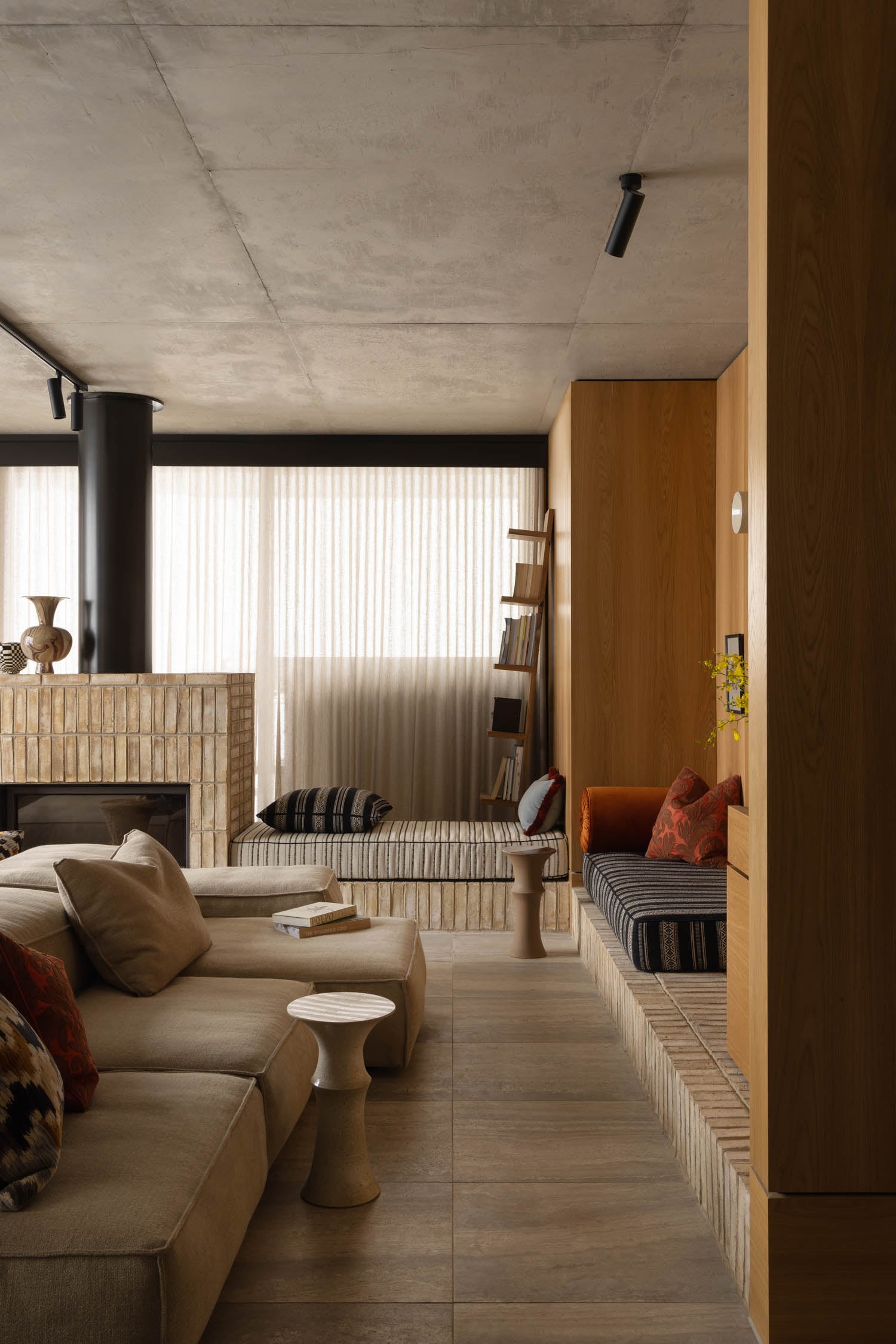 living room nook with sofa facing wood panels