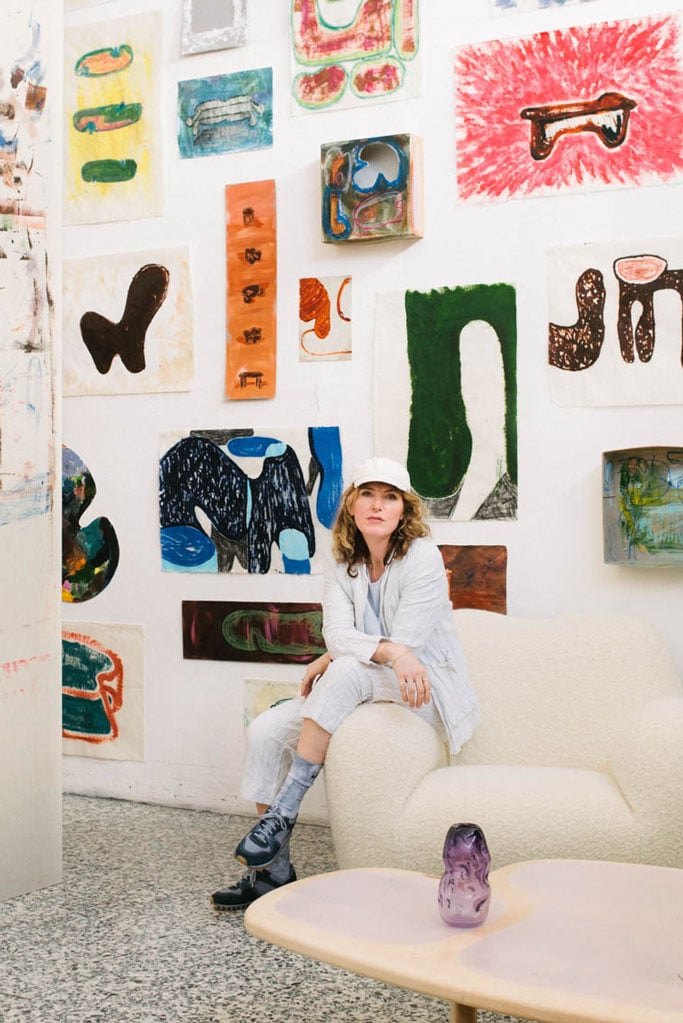 faye toogood in her studio wearing a white baseball hat