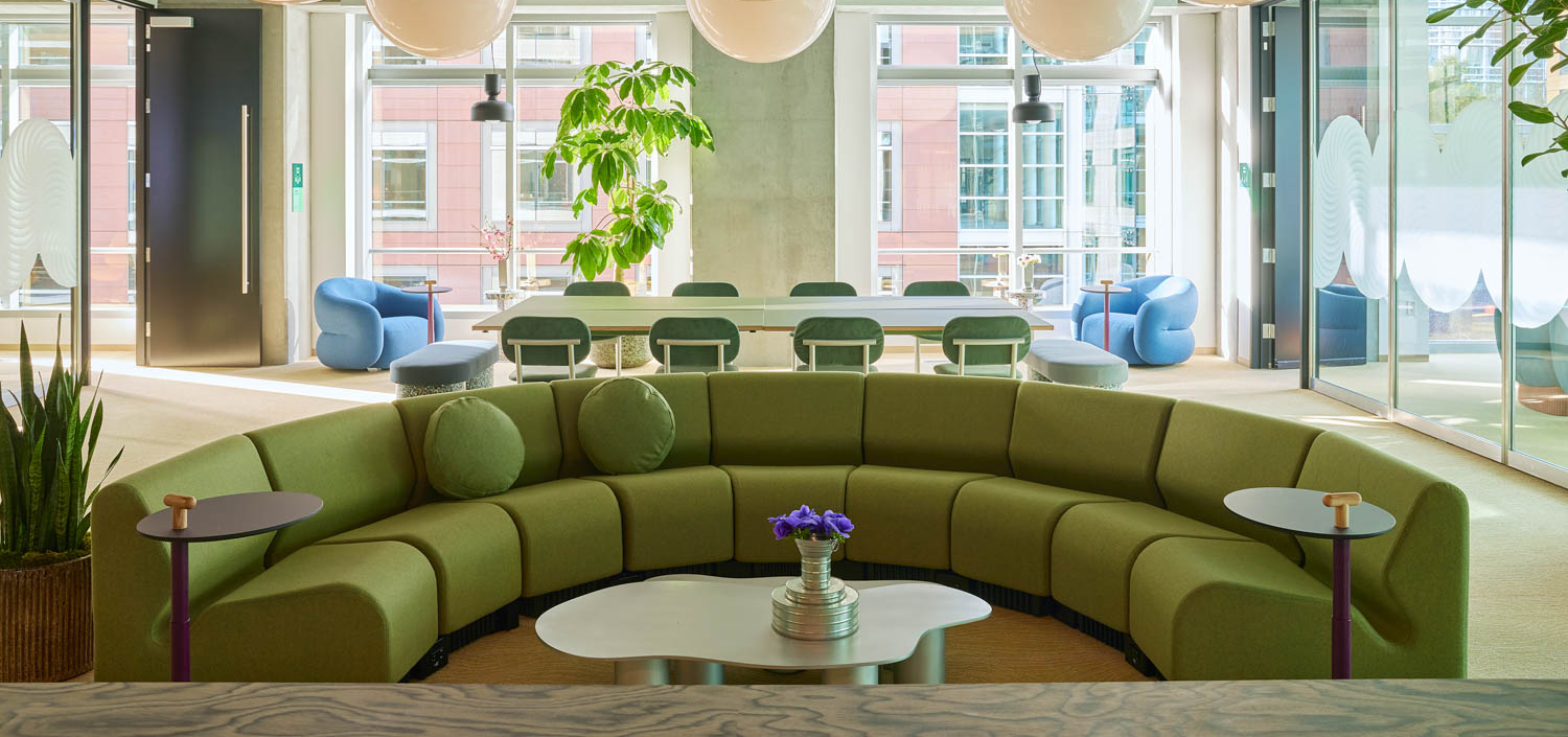 coworking space with curved green sofa