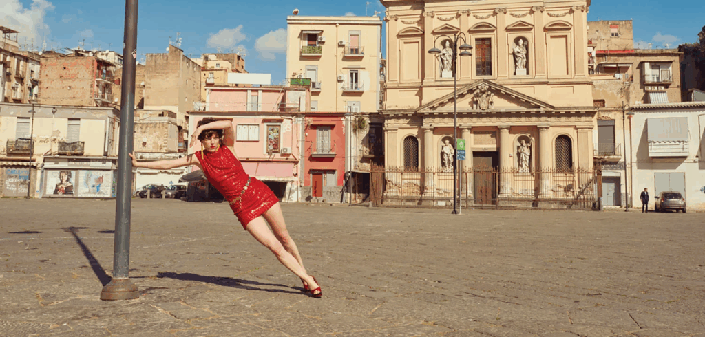 woman posing against backdrop